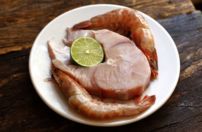 Dogfish steak and prawns - ready for the grill Photo by: (c) rocharibeiro www.fotosearch.com