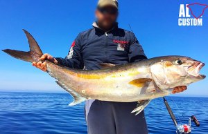 Fisherman proudly displaying his large Amberjack catchPhoto by: ALCUSTOM boats [public domain]https://creativecommons.org/licenses/by/2.0/